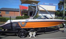 Australian Wheel Clamp securing Camero Boat and Trailer Vision 21 2014