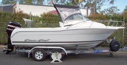 Australian Wheel Clamp securing Cruise Craft Boat and Trailer