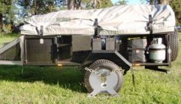 Australian Wheel Clamp securing All Terrain Walk Up Deluxe camper trailer